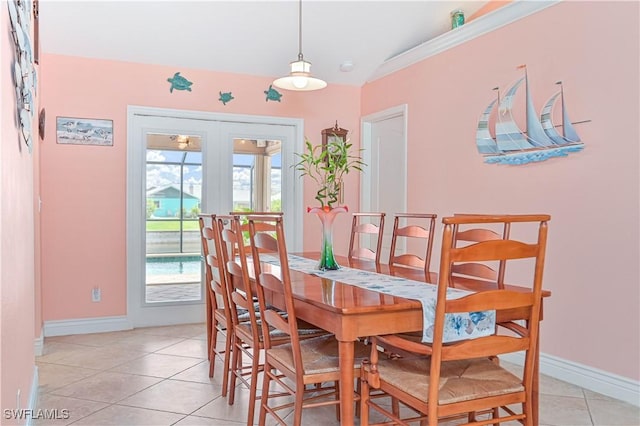 1826 SE 6th Ave, Cape Coral, FL 33990 - dining space with french doors, light tile patterned flooring, and baseboards