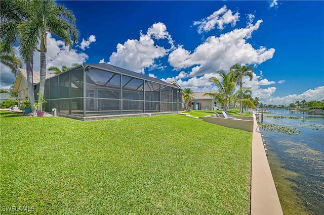 1826 SE 6th Ave, Cape Coral, FL 33990 - view of green lawn with a water view and glass enclosure