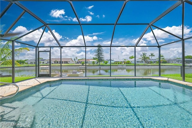 1826 SE 6th Ave, Cape Coral, FL 33990 - swimming pool featuring a water view, glass enclosure, a residential view, and a patio area