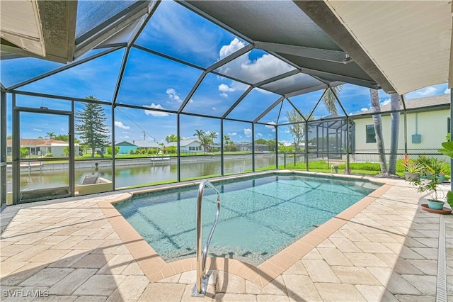 1826 SE 6th Ave, Cape Coral, FL 33990 - swimming pool featuring a water view, a patio area, and a lanai