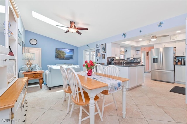 1826 SE 6th Ave, Cape Coral, FL 33990 - dining space featuring a ceiling fan, vaulted ceiling, and light tile patterned flooring