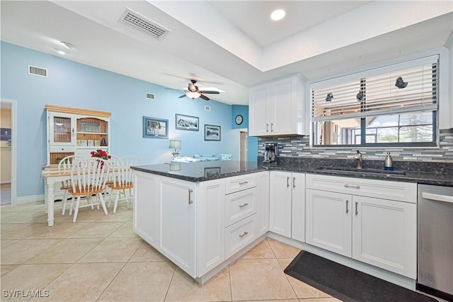 1826 SE 6th Ave, Cape Coral, FL 33990 - kitchen featuring a sink, dishwasher, a peninsula, and backsplash