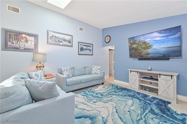 1826 SE 6th Ave, Cape Coral, FL 33990 - living area with baseboards and a skylight