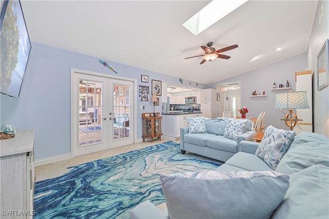 1826 SE 6th Ave, Cape Coral, FL 33990 - living room featuring french doors, a ceiling fan, a skylight, lofted ceiling, and baseboards