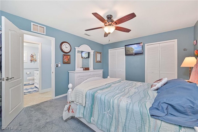1826 SE 6th Ave, Cape Coral, FL 33990 - bedroom with two closets, baseboards, light carpet, a ceiling fan, and light tile patterned floors