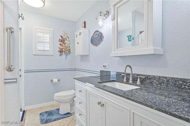 1826 SE 6th Ave, Cape Coral, FL 33990 - bathroom featuring vanity, toilet, and tile patterned floors