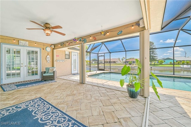 1826 SE 6th Ave, Cape Coral, FL 33990 - view of patio featuring french doors, a lanai, a ceiling fan, and an outdoor pool