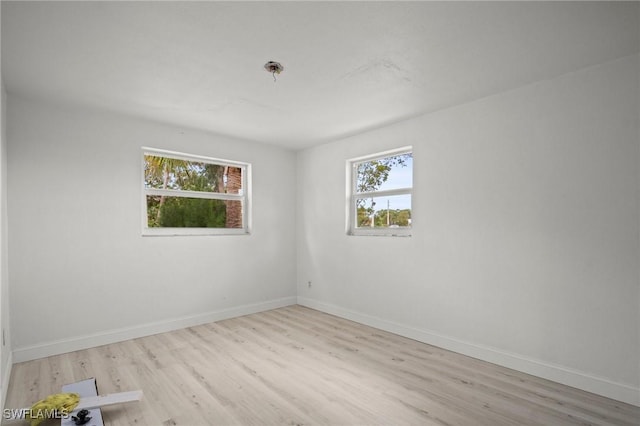 2316 Bayside St, Naples, FL 34112 - unfurnished room with wood finished floors and baseboards