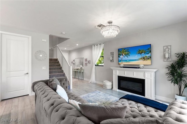 7619 Morgan Way, Naples, FL 34119 - living room featuring light wood-style floors, stairs, a chandelier, baseboards, and recessed lighting