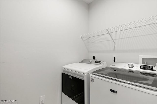 7619 Morgan Way, Naples, FL 34119 - laundry area featuring separate washer and dryer