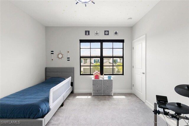 7619 Morgan Way, Naples, FL 34119 - bedroom with light carpet and baseboards