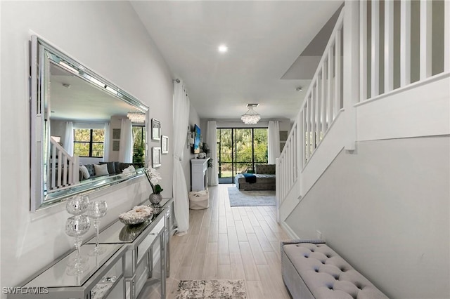 7619 Morgan Way, Naples, FL 34119 - entrance foyer featuring stairway, plenty of natural light, light wood-type flooring, and baseboards