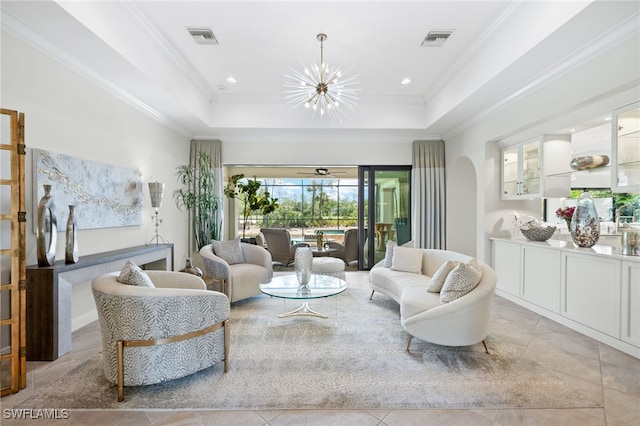 14500 Marsala Way, Naples, FL 34109 - living area featuring a raised ceiling, a chandelier, crown molding, light tile patterned flooring, and arched walkways