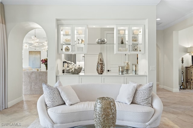 14500 Marsala Way, Naples, FL 34109 - living room with arched walkways, light tile patterned flooring, ornamental molding, baseboards, and recessed lighting