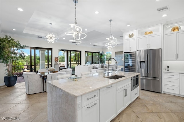 14500 Marsala Way, Naples, FL 34109 - kitchen with stainless steel refrigerator with ice dispenser, a sink, light tile patterned flooring, plenty of natural light, and recessed lighting