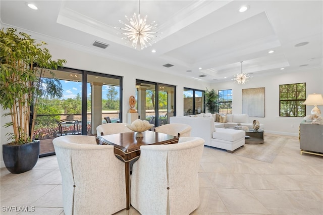 14500 Marsala Way, Naples, FL 34109 - living room featuring a chandelier, a tray ceiling, light tile patterned flooring, crown molding, and baseboards