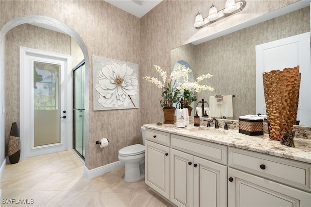 14500 Marsala Way, Naples, FL 34109 - bathroom with vanity, toilet, a shower stall, and baseboards