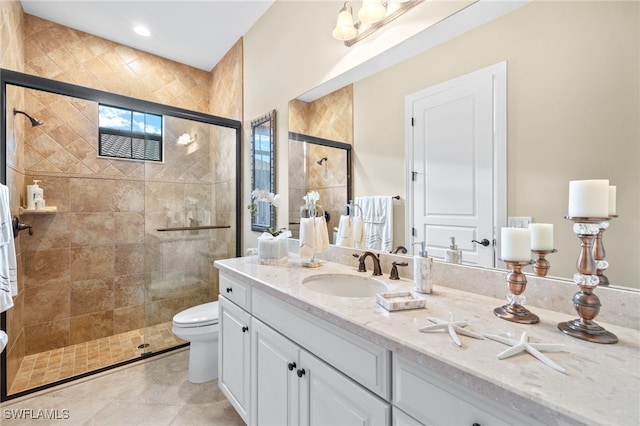 14500 Marsala Way, Naples, FL 34109 - bathroom with vanity, a stall shower, and toilet