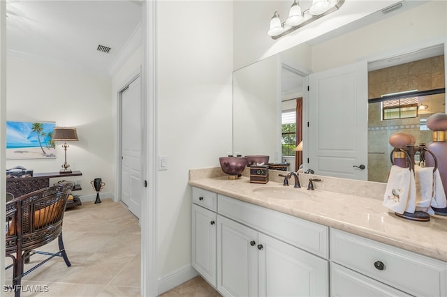 14500 Marsala Way, Naples, FL 34109 - bathroom featuring vanity, ornamental molding, and baseboards