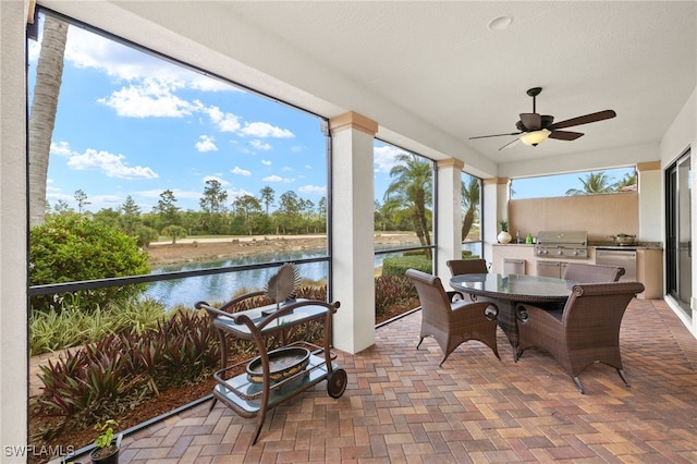 14500 Marsala Way, Naples, FL 34109 - view of patio featuring ceiling fan, a water view, and outdoor dining space