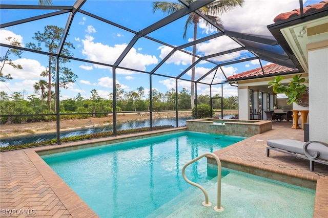 14500 Marsala Way, Naples, FL 34109 - outdoor pool with an in-ground hot tub, a patio area, glass enclosure, a water view, and view of scattered trees