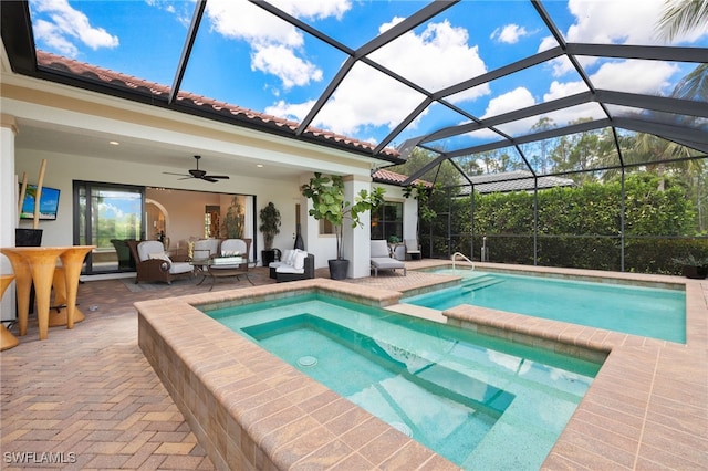 14500 Marsala Way, Naples, FL 34109 - view of swimming pool featuring an outdoor hangout area, a patio area, ceiling fan, a lanai, and a pool with connected hot tub