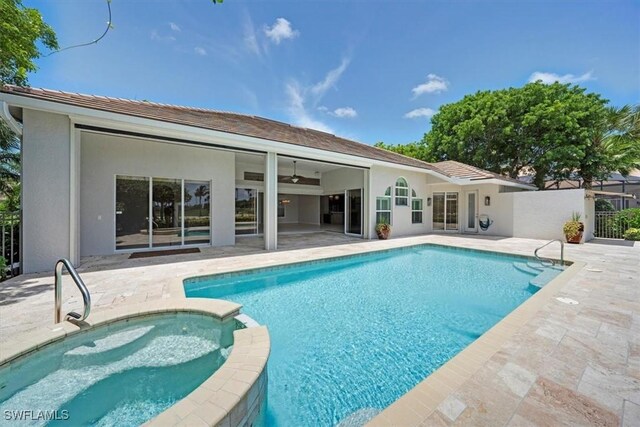 2366 Alexander Palm Dr, Naples, FL 34105 - view of swimming pool with a patio, a pool with connected hot tub, and a ceiling fan