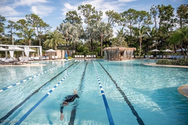 2366 Alexander Palm Dr, Naples, FL 34105 - community pool featuring a patio area