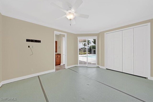 2366 Alexander Palm Dr, Naples, FL 34105 - unfurnished bedroom featuring baseboards, a closet, ensuite bathroom, a ceiling fan, and access to exterior