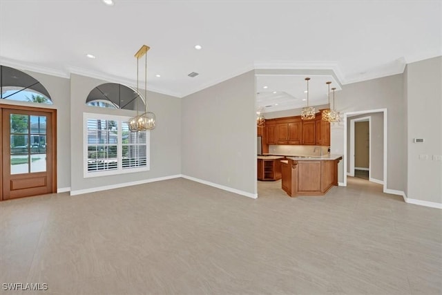 2366 Alexander Palm Dr, Naples, FL 34105 - kitchen with open floor plan, crown molding, a chandelier, light countertops, and baseboards