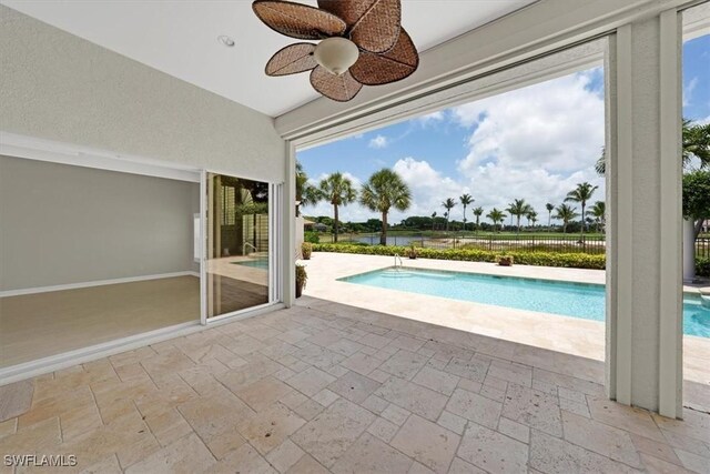 2366 Alexander Palm Dr, Naples, FL 34105 - view of swimming pool with ceiling fan and a patio area