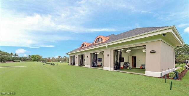 2366 Alexander Palm Dr, Naples, FL 34105 - rear view of property featuring a yard and stucco siding