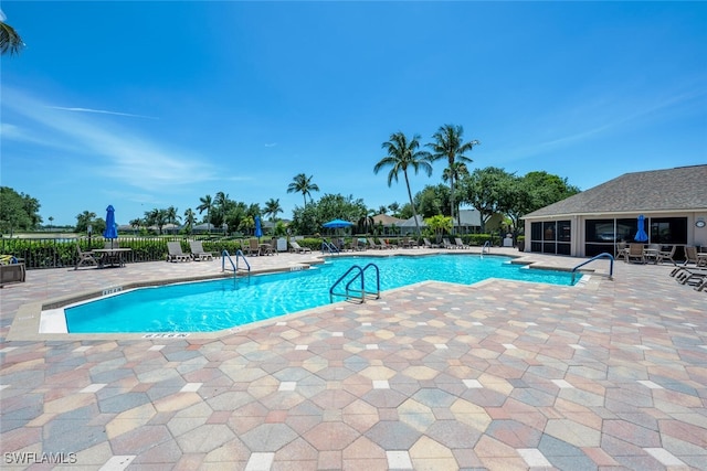 8279 Ibis Cove Cir Unit A136, Naples, FL 34119 - community pool with a patio