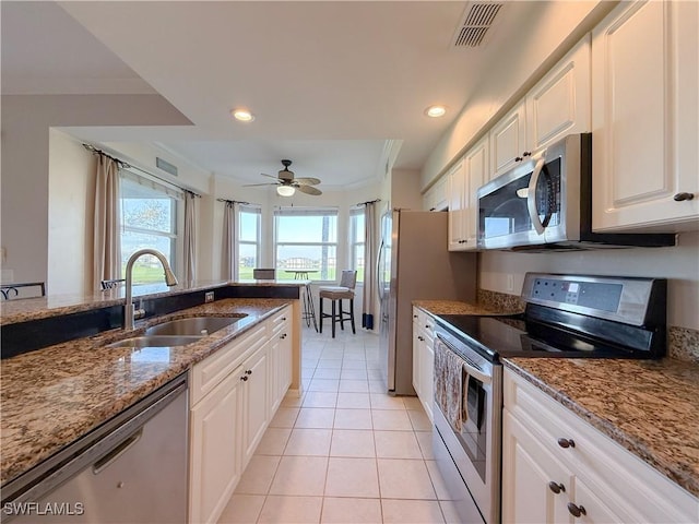 10350 Washingtonia Palm Way Unit 4213, Fort Myers, FL 33966 - kitchen with appliances with stainless steel finishes, a sink, light tile patterned flooring, healthy amount of natural light, and recessed lighting