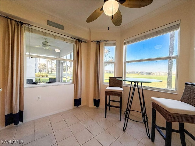 10350 Washingtonia Palm Way Unit 4213, Fort Myers, FL 33966 - dining space featuring a ceiling fan, crown molding, healthy amount of natural light, and light tile patterned flooring