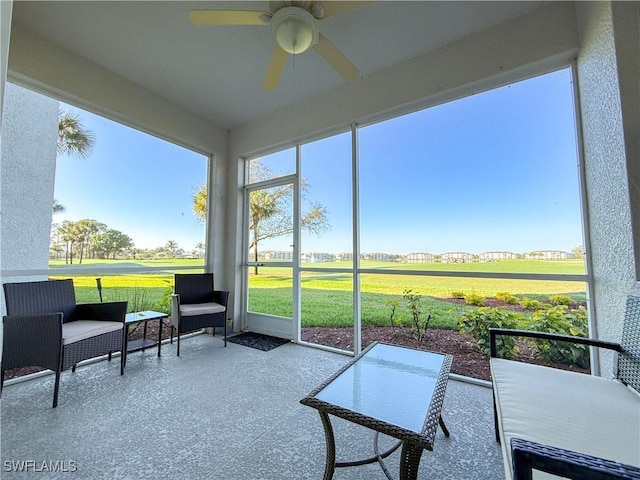 10350 Washingtonia Palm Way Unit 4213, Fort Myers, FL 33966 - sunroom / solarium featuring a ceiling fan and view of golf course