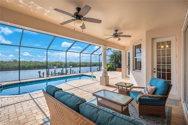 1128 NW 43rd Ave, Cape Coral, FL 33993 - view of patio featuring a water view, an outdoor pool, a ceiling fan, and a lanai
