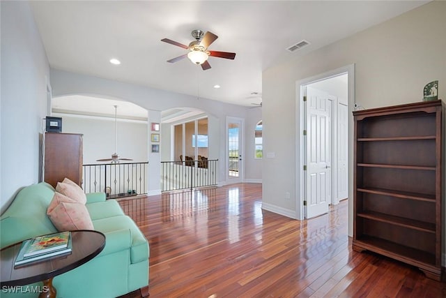 1128 NW 43rd Ave, Cape Coral, FL 33993 - living area featuring a ceiling fan, arched walkways, wood finished floors, baseboards, and recessed lighting