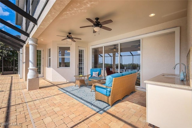 1128 NW 43rd Ave, Cape Coral, FL 33993 - view of patio with a sink, a ceiling fan, and outdoor lounge area