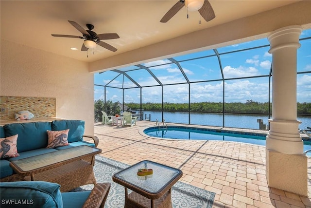 1128 NW 43rd Ave, Cape Coral, FL 33993 - swimming pool featuring ceiling fan, a patio, an outdoor living space, and a water view