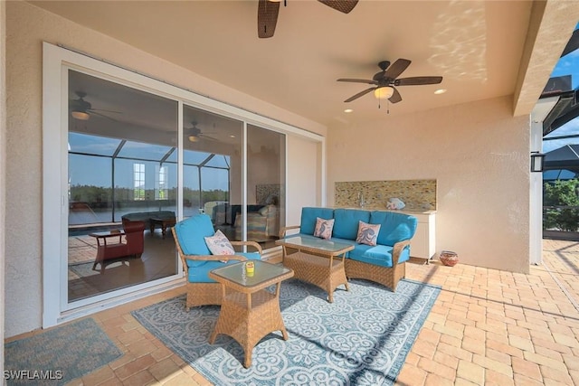 1128 NW 43rd Ave, Cape Coral, FL 33993 - view of patio featuring ceiling fan, a lanai, and an outdoor hangout area