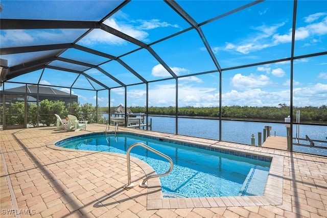 1128 NW 43rd Ave, Cape Coral, FL 33993 - outdoor pool with a dock, boat lift, a patio area, and a water view