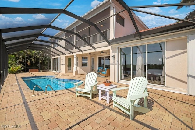 1128 NW 43rd Ave, Cape Coral, FL 33993 - outdoor pool featuring a patio area, ceiling fan, and glass enclosure