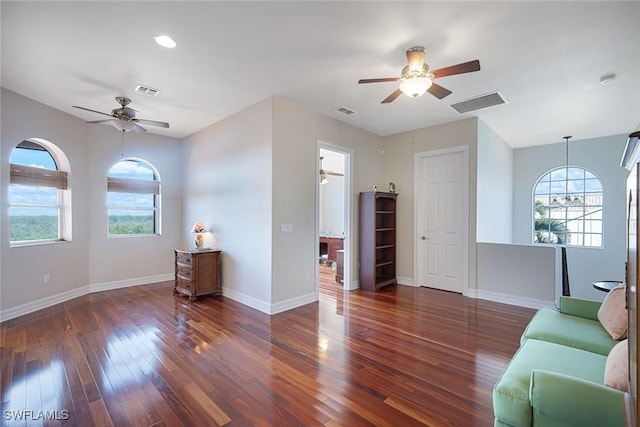 1128 NW 43rd Ave, Cape Coral, FL 33993 - living room with a ceiling fan, healthy amount of natural light, and wood finished floors