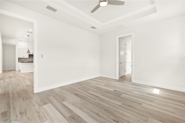 2110 SW 52nd Ter, Cape Coral, FL 33914 - unfurnished room with a tray ceiling, a ceiling fan, light wood-style floors, baseboards, and recessed lighting