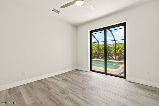 2110 SW 52nd Ter, Cape Coral, FL 33914 - unfurnished room featuring a ceiling fan, light wood finished floors, and baseboards