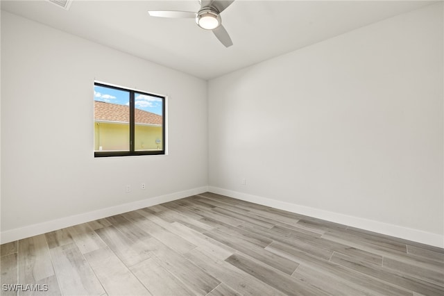 2110 SW 52nd Ter, Cape Coral, FL 33914 - empty room with light wood-style floors, a ceiling fan, and baseboards