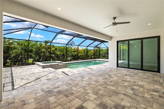 2110 SW 52nd Ter, Cape Coral, FL 33914 - view of swimming pool featuring a patio, a ceiling fan, glass enclosure, and a pool with connected hot tub