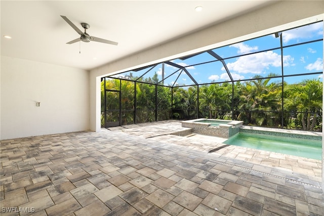 2110 SW 52nd Ter, Cape Coral, FL 33914 - view of swimming pool with a patio area, a lanai, ceiling fan, and a pool with connected hot tub