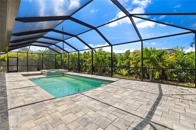 2110 SW 52nd Ter, Cape Coral, FL 33914 - view of swimming pool with a patio, a pool with connected hot tub, and glass enclosure